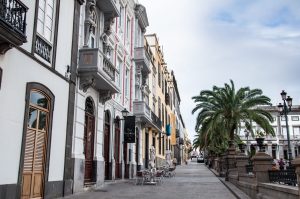 A typical street scene in the centre of Las Palmas. House fronts are ornate with balconies
