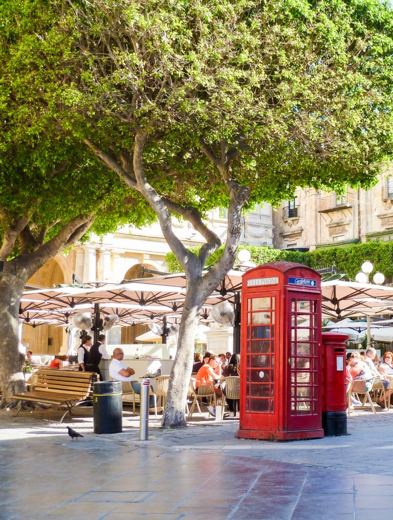A sign of the past. A British style phone box and red post box in Valletta