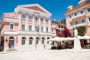 A colourful square in Corfu Town is basked in sunshine