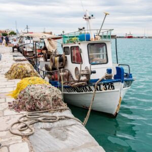 Small white fishing boat at the harbour in Zakynthos town