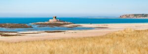 Panorama of La Rocco Tower in St Ouen's Bay from 5 mile road, Jersey