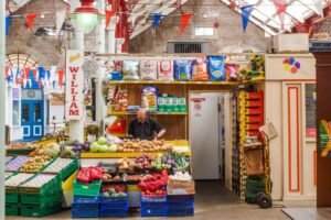 A fruit and veg stall inside the central market in St Helier