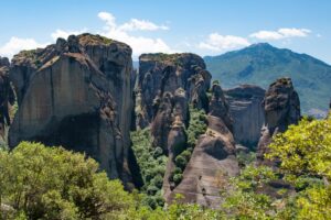 Meteora in Greece: The rocks of Meteora with the Pindus mountains in the background
