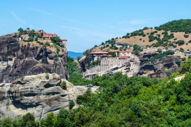 Monasteries of Great Meteoran  on the left and Varlaam on the right sit on the clifftops on Meteora